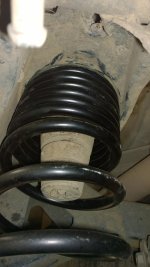 passenger rear coil seated in bucket.jpg