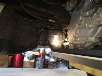 driver side cross member goes between brake-line bracket and frame.jpg