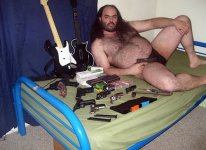 fat_hairy_guy_on_bed_with_guns.jpg fat_hairy_guy_on_bed_with_guns.jpg