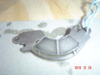 Magnet with Dark Metal From Wear In Splitter's Fluid.JPG