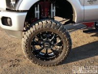 1201-8l-09+shop-truck-gone-wild-2011-ford-f250-crew-cab+bmf-22-inch-wheels.jpg