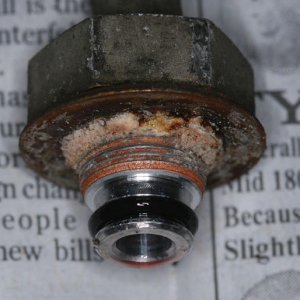 Outlet fitting after removal from cooler. O-ring looks good, however considerable corrosion is eveident inside of flat washer. Flat washers do not pro