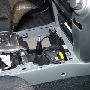 Wiring in console. Hole drilled in console side for installation of the socket.