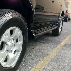 Cleaned out rust on rocker panels & installed OEM Running boards painted 202 black.