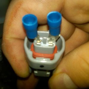 Fit both of the trimmed connectors into the contact points in the adaptor