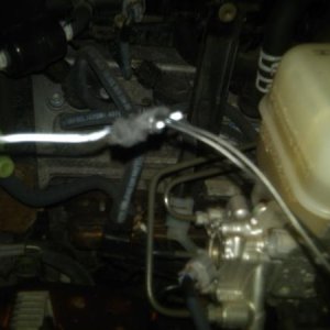 I used a coat hanger to GENTLY fish the wires through the gromet.