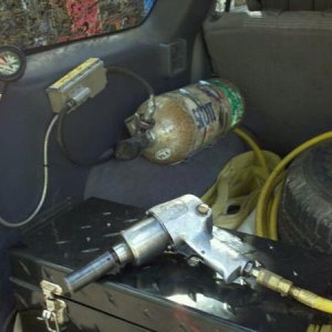 On board air with Scotts tank. 4500 psi with dumb down regulator to 130 psi.