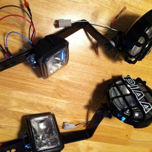 Floating Piaa 520 ATP and Hella Micro FF, Put 100w bulbs in the Hellas first thing.
Also added a clear 3m type film coating on all the lights for a li
