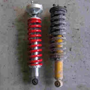 Toyotec front coilovers vs Old Man Emu - I like that the spring sits in a cup thats below the pivot point.