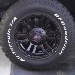 close up of the new rims right after installation. still a little grease on them, but they'll get cleaned up eventually.