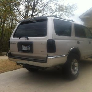 The tail light covers are very black but they still allow a very good amount of light to pass through them. They stick on with Velcro and 3M tape, and