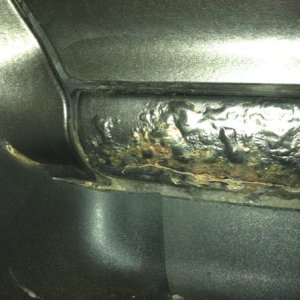 Rust Removal on drivers side rocker panel(Before)