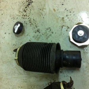The metal plate in the top right is what now holds the base/bottom of the rear springs from the lift kit I had installed.
