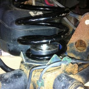 This is the rear spring sitting on the bottom plate from the GX470 kit.  Notice that the base of the 4runner spring is smaller than that of the GX470 