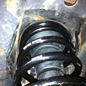 This shows the stock bumpstop installed to hold the top of the spring in place on the rear suspension.