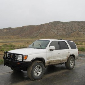 After a wet couple hours of mudding/wheeling. Barely got out of there, notice the "bald" tires...
