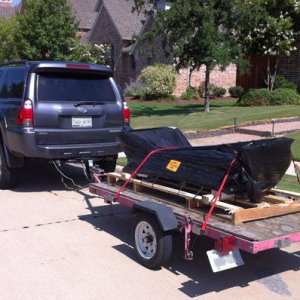 Picked up my freight from CBI Off-road:  rear bumper with swingout tire carrier and weld-on rock sliders.