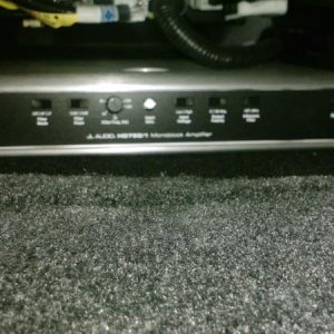 This is the sub-woofer system's "silent partner", the electrical "Power Plant", the amplifier. Safely contained in the floor well  beneath the driver 