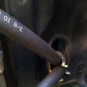 wrapped lines with heater hose to protect them through the hole adjacent the rad