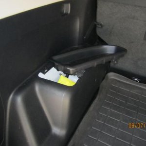 Driver side storage mod. Took about 30 seconds once I figured the "brute force" required