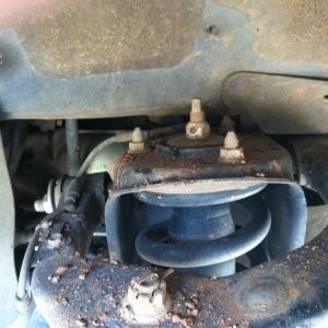 Upper strut mounts were simple, but the coilovers had allen bolts that dropped in vs. studs that stick up. Aligning the holes and putting the bolts in