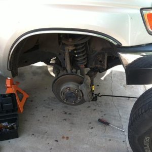 Changing out the front struts with some coilovers.