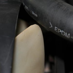 How much clearance I used to have between rad. hose and fan blade.
