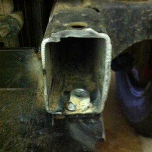 Cut frame ends off, drilled hole in the bottom and welded a nut to mount to.