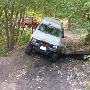 After struggling to get through this obstacle, the Jeeps behind me went around. Running with open diffs at this time.

Tuttle Creek