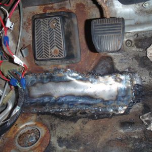 My patch work. Not the best in the world, but it'll hold. After I welded it, I cleaned it up and throw a fiberglass resin and cloth on top of it on th