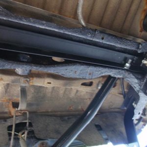 fabricated a piece of angle iron to give the old rusty tire carrier crossmember some support.