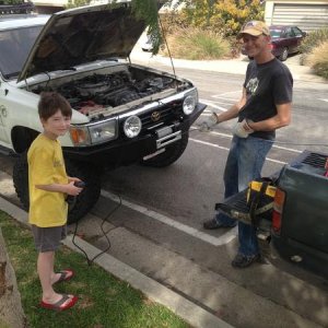 My step son helping to install the cable. Getting him started early and a co-driver