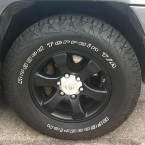The flat black wheel with Rugged Terrain tires. I'm thinkin about getting that center silver done in flat black too, but it looks sick how it is.