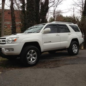 2 1/2" Leveling kit, 1 1/2" wheel spacers (soon to get XD Black Spy rims) front bull bar w/lights, K&N filter, new exhaust, 32" tires.  CD/DVD player 