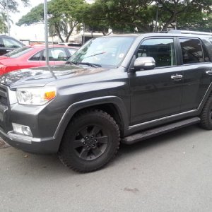 blacked out wheels, running boards, grill, and rack footings.