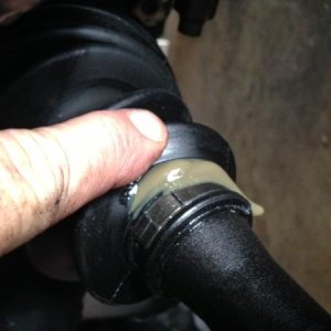 CV boot tear from cycling suspension (12 years and 200k miles+long travel=messy undercarriage!)