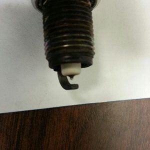 Spark Plug Pic - Typical of all removed - Closeup of electrode - Noticeable wear of electrode compared to new plug