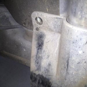 If rubbing in lower left (in the picture), drill new hole for the screw in the upper inner corner of the mud flap, that will help flatten the "bulge" 