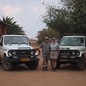 Namibia Africa Safari in 2002 in front of our guides 2 Toyota diesel Land Cruisers. Notice the LC's are NOT SUV's - they are pickups.. .  This is wher
