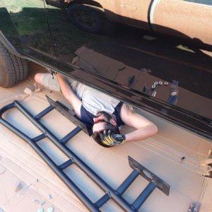 Installing BudBuilt Sliders in apartment parking lot. Summer in OK!