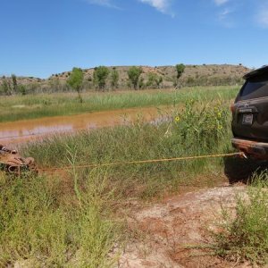 Pulling a quad out of the Canadian River.