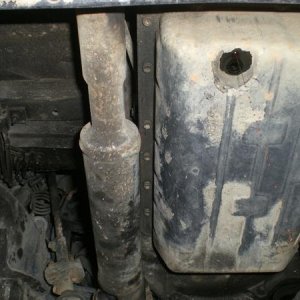 The bolts on the drivers' side on the tranny pan. They were all 10mm head socket. The drain plug on the pan is 14mm. The driveshaft for the front diff