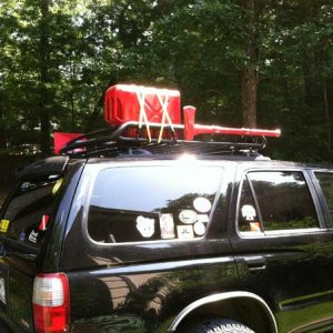 Gas tank, shovel, and axe on the roof rack.