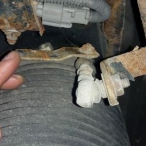 Height adjuster bracket is rusted away and broken.