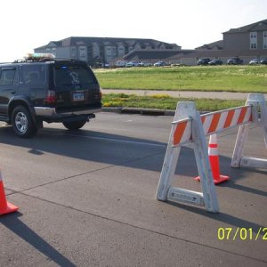 Blocking a road after heat expansion cracked the concrete.