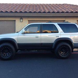 Painted fender flares and side panels flat black (before lift kit).