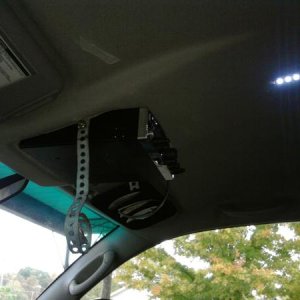 0107802304. There's a place in the roof frame to bolt on some hanger strap and it lines up almost perfectly with the radio's mounting holes.