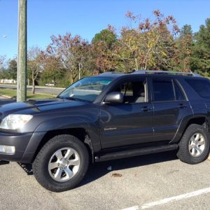 Daystar 1" Budget Boost Leveling Kit, All-Pro 1.5" spacer, Cooper Discoverer AT3 tires. [Front Angle]