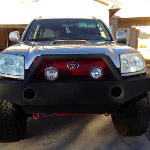 I made a custom grill from a honeycomb patter piece of steel , also moved my fogs and ordered a set of 4" led flood lights for the bumper.