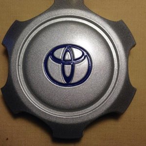 After:  With the help of Dupli-Color's Metallic Silver wheel paint, clear coat and gotsignsnow.com vinyl Toyota logos (1.52" h x 1.72" w, lots of colo